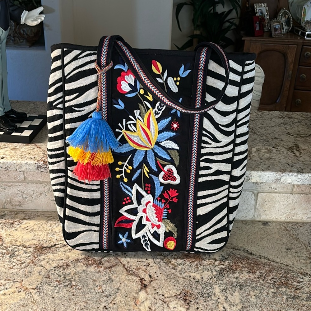 Incredible zebra print tote bag with gorgeous bright embroidery with fun tassel.